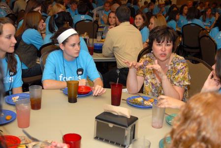 Ashley Blair, assistant professor of communication arts, talks with incoming freshmen who are interested in the communication arts department during new student orientation. - Photo by Kristi McMurry Woody