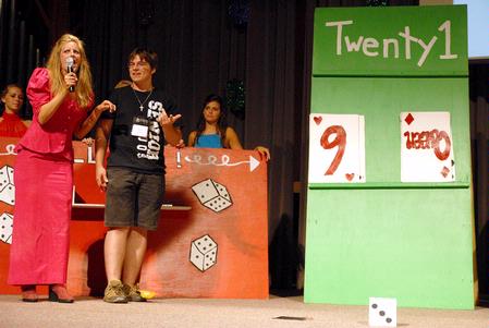 Zach Preston, freshman, plays a dice game at the SAC Game Show. - Photo by Kristi McMurry Woody
