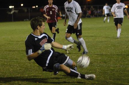 J. Landham, dives to save the ball in the men's soccer game against Campbellsville University on Sept. 11. - Photo by Sarah Palmer Goff