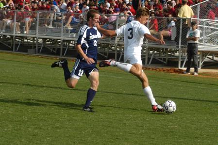 Taylor Mayo clears the ball during the men's soccer match against Reinhardt on Sept. 12 - Photo by Sarah Palmer Goff