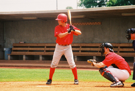 Union center fielder, Joel Hysmith of Jackson, Tenn. bats as the current Bulldogs battle the alumni at the 2003 Alumni game.  John Melton, a 2000 baseball alumnas and former Arizona Diamondback minor league player is catching. - Photo by Steven Aldridge