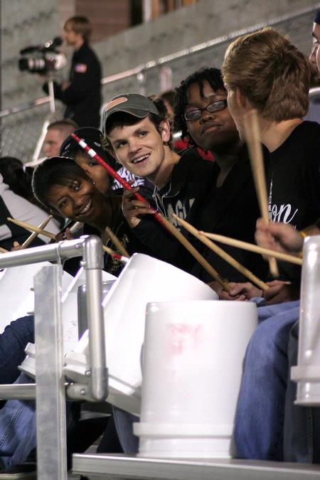 Noah Arnold, senior history major, Treasure Hightower, sophomore journalism major and other Union drumline members keep fans motivated during the men's soccer game against William Carey. - Photo by Kristi McMurry Woody