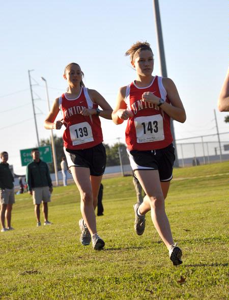 Carrie Moore (left) and Hannah Stags prepare for the Union Cross Country Invitational. - Photo by Uncredited