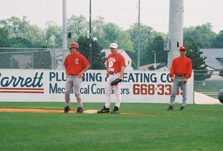 Union baseball alumnas of 1998, Brandon Myhand covers first as the Bulldog alumni take on the current Bulldog players after the 2003 season.  Graduate Assistant Chuck Cooper looks on from the first base coaching box. - Photo by Steven Aldridge