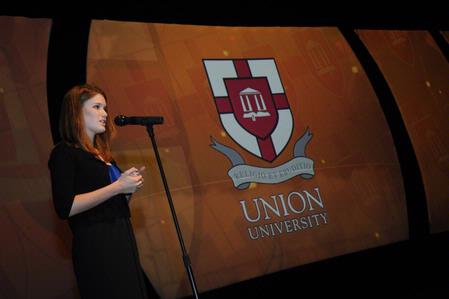 SGA President Courtney Bragg gives the invocation at the 2009 Scholarship Banquet. - Photo by Morris Abernathy