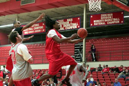 Tacuma Alexander, senior, goes up for a shot during a scrimmage for Bulldog Madness. - Photo by Kristi McMurry Woody