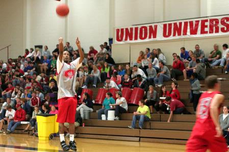 Stan McNeil, junior, shoots three pointers in a competition against one of the Lady Bulldogs during Bulldog Madness.  - Photo by Kristi McMurry Woody