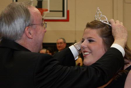 Dr. Dockery crowns Katy Pope, senior art major, homecoming queen during half-time of the lady bulldogs basketball game on November 7, 2009. - Photo by Megan Bailey