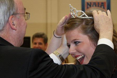 Dr. Dockery crowns Katy Pope, senior art major, homecoming queen during half-time of the lady bulldogs basketball game on November 7, 2009. - Photo by Megan Bailey