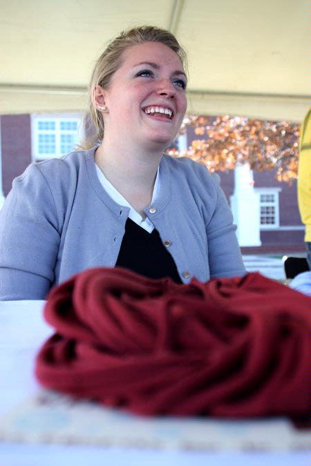 Amanda Chambers, sophomore art major, sells her unique t-shirt wraps during Arts in the Park for Homecoming 2009. - Photo by Megan Bailey