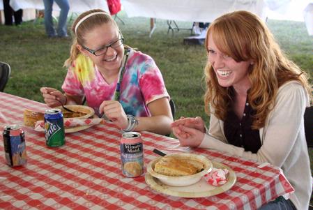 Anna Gilbreth, junior nursing major, and Brooke Walker, senior nursing major, enjoy a time of fellowship over lunch at Arts in the Park for Homecoming 2009. - Photo by Megan Bailey