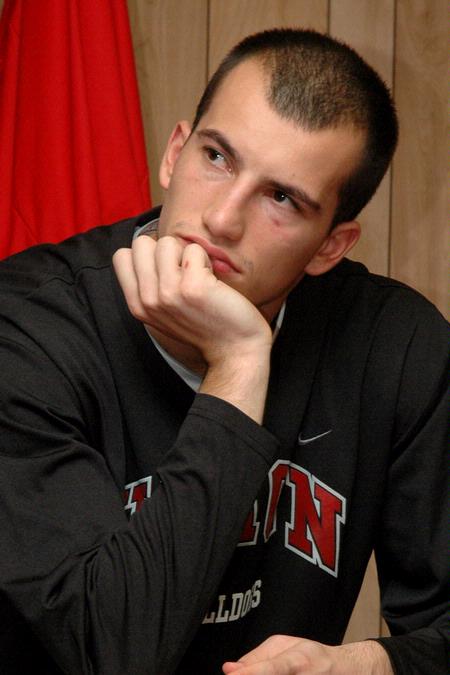 Veljko Petrovic and the Bulldogs listen to Coach Niven during half time, Nov. 27. - Photo by Beth Spain