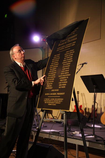 President Dr. David Dockery unveils the plaque honoring the Board of Trustees that provided resources and leadership after the tornado of Feb. 5, 2008. - Photo by Angela Abbamonte