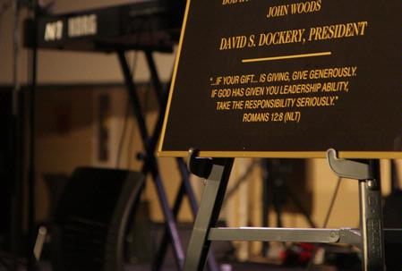 Romans 12:8 adorns the bottom of the plaques that will hang in the new Bowld Commons recognizing the leadership and generosity of the Board of Trustees, the people who built the building and the Student Life team. - Photo by Angela Abbamonte