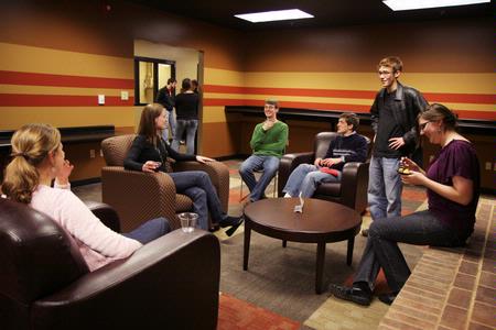 Students hang out near one of the fireplaces in the new Bowld Commons building. - Photo by Angela Abbamonte