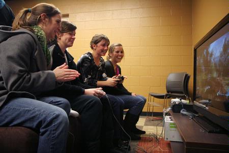 Students enjoy playing games in the new Game Room at the grand opening of the Bowld Commons. - Photo by Angela Abbamonte