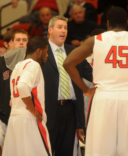 Union head coach, David Niven talks with Martez Hawkins (13) and Roland Banhoro (45). - Photo by Morris Abernathy