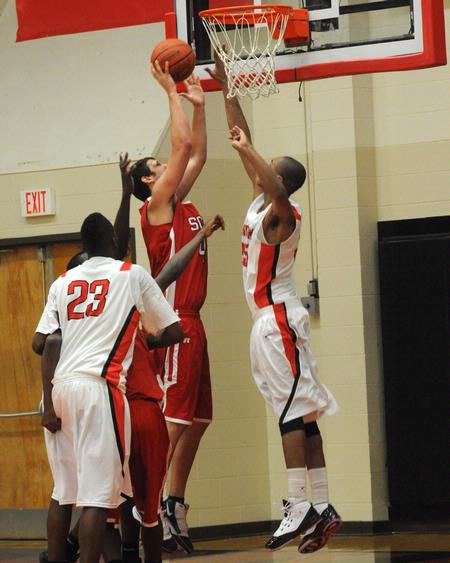 Keith Tolliver (35) goes up for the block. - Photo by Morris Abernathy