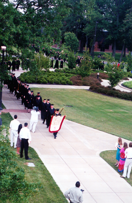 The Union University faculty proceeds to the Great Lawn for Spring Graduation 2003. - Photo by Justin Veneman