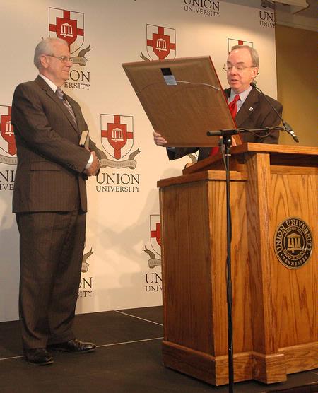 Union University President, David Dockery (right),  presents a plaque to Jerry Rankin, for his dedication and service to the International Mission Board during his term as president. - Photo by Jordan Buie