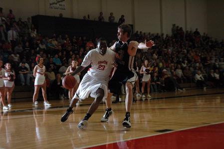 Senior Greg Truvillion drives toward the basket during the TranSouth Tournament championship game against Freed Hardeman University. The Bulldogs won 75-65. - Photo by Jordan Buie