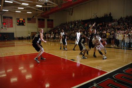 Senior Keith Tolliver drives toward the basket during the TranSouth Tournament championship game against Freed Hardeman University. The Bulldogs won the game 75-65. - Photo by Jordan Buie
