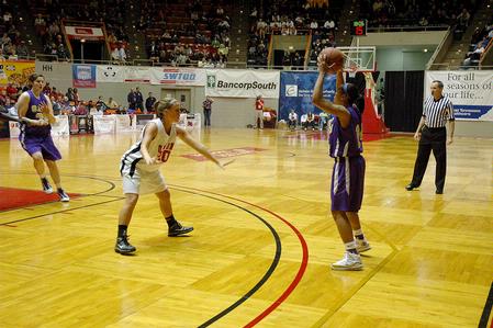 Kayla Hudson, junior political science major, defends the ball against Southwestern Assemblies of God University in Game 1 of the NAIA Women's Basketball National Tournament. The Lady Bulldogs won 86-47. - Photo by Jordan Buie