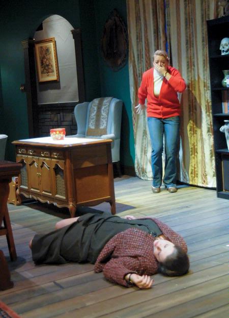 Molly Ralston, played by Jillian Barron, discovers the body of Mrs. Boyle, played by Margaret Broersma, who is a victim of the mystery killer in Agatha Christie's The Mousetrap presented by Union University Players. - Photo by Morris Abernathy