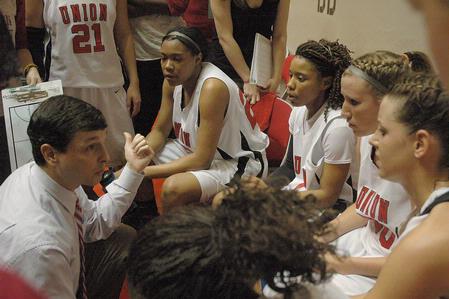 Mark Campbell, head women's basketball coach, talks with his players during a time-out in the Second Round game of the NAIA National Tournament. The Lady Bulldogs defeated Southern Polytechnic State University 70-47. - Photo by Jordan Buie
