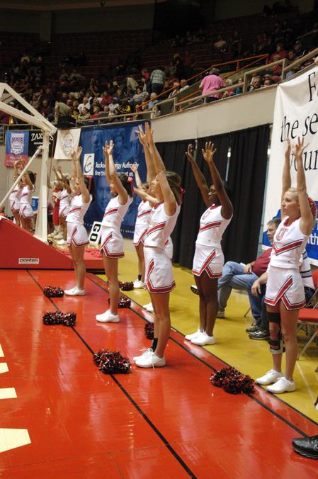 The Union University cheerleaders keep the morale high during the Second Round game of the NAIA National Tournament against Southern Polytechnic State University. The Lady Bulldogs won 70-47. - Photo by Lauren Laster