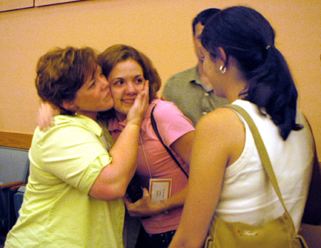 The Staats family of Rockvale, Tenn. says goodbye to their daughter Emily after the FOCUS 2003 worship service on Saturday night. - Photo by Lindsay Stavish