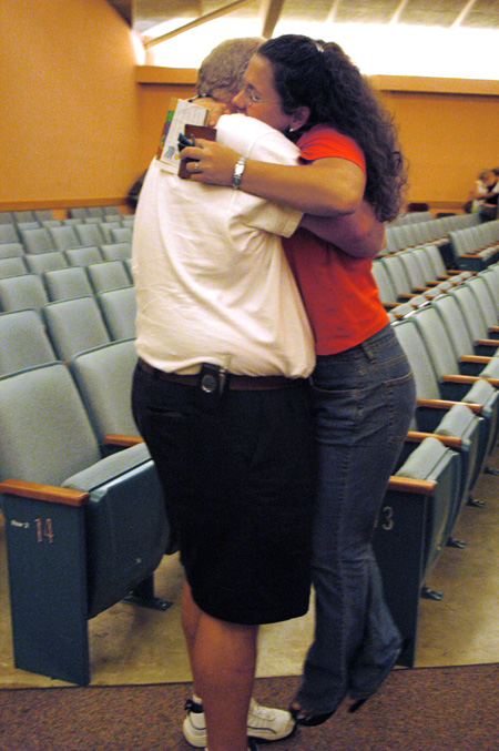 Carrie Jones of Ripley, Tenn. says goodbye to her father after the FOCUS 2003 worship service on Saturday night.  - Photo by Lindsay Stavish