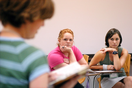 FOCUS leader Courtney Ross shares Scripture with Freshmen Patty Williams of Franklin, Tenn. and Mary Ferrell of Milan, Tenn. - Photo by Kristen Nicole Sayres