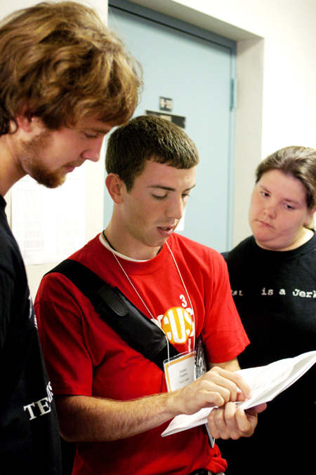 Andrew McBride, Jason Vaughan, and Jessica Riley examine their FOCUS schedule. - Photo by Kristen Nicole Sayres