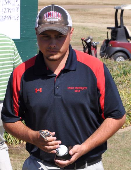 Ryan Chandler receives his trophy for a third place finish in the Union University Spring Invitational. - Photo by Steven Aldridge
