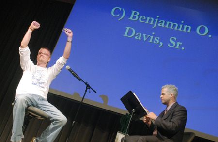 Jonathan Giles of Wartburg, Tenn. shares his enthusiasm with the crowd after answering a question moving him into the next round during SAC's game show for FOCUS 2003. - Photo by Justin Veneman