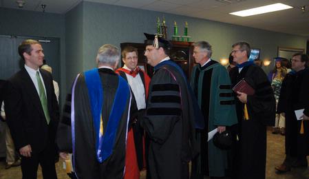 Jason Castles and Dr. Ray Van Neste stand in a receiving line after the awards service. Castles was named Staff Member of the Year, and Van Neste was named Faculty Member of the Year.  - Photo by Morris Abernathy