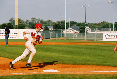 Senior catcher, Roger Cook (20) rounds third after one of his homeruns during the 2003 season. - Photo by Kristen Hiller