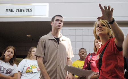 During a tour with her FOCUS Group, Adrienne Briles points out the Campus Ministries offices to Freshman Daniel Lindley of Drummonds, Tenn. - Photo by Justin Veneman