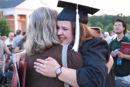 Theatre/Speech graduate, Margaret Broersma, hugs friends and family after the spring 2010 commencement ceremony.  - Photo by Abigail Harris