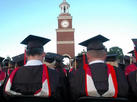 Masters graduates wait to receive their diplomas during the Spring 2010 graduation ceremony. - Photo by Beth Spain