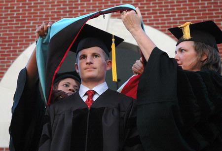 Matthew Brunett, director of wellness services, receives his doctorate degree during the Spring 2010 commencement ceremony. - Photo by Beth Spain