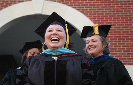 Jennifer Wyatt receives her doctorate degree during the Spring 2010 commencement ceremony. - Photo by Beth Spain