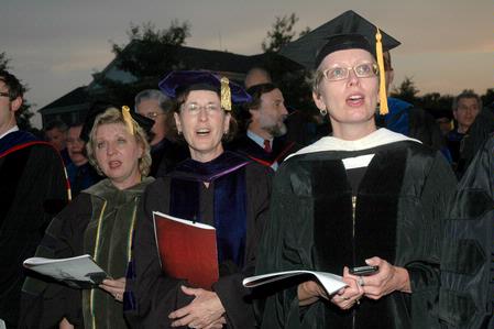 Faculty members sing the Alma Mater to conclude the Spring 2010 commencement ceremonies. - Photo by Beth Spain