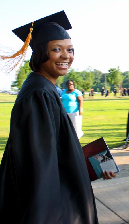 Shemeka Davis, graduating nursing major, smiles during the processional to spring 2010 commencement ceremonies. - Photo by Ebbie Davis