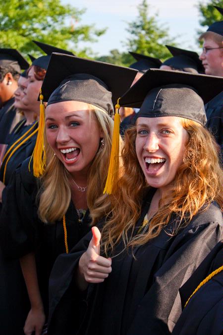 Social work majors Rachel Phillips and Leslie Ragon show excitement at the spring 2010 commencement ceremony. 
 - Photo by Ebbie Davis
