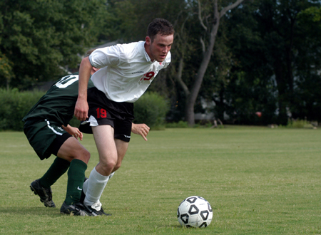 Gareth Munro (19) takes the ball from an oppenent. - Photo by Jonathan Blair