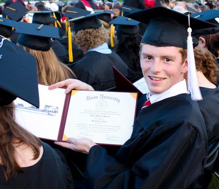 David Kissell, Christian studies graduate, shows off his diploma at the spring 2010 commencement ceremony.   - Photo by Ebbie Davis