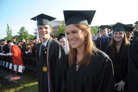 Courtney Bragg happily anticipates graduating along with classmates Noah Arnold and Blair Hoglen at the 2010 commencement ceremony.  - Photo by Morris Abernathy