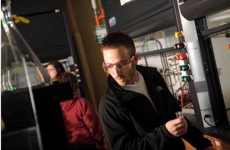 Students work on a chemistry experiment in lab. - Photo by Morris Abernathy